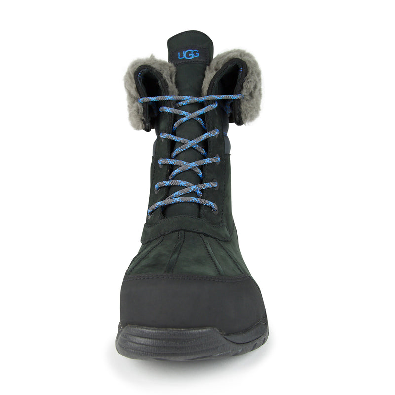 Black quilted boot with fur lining and blue laces, featuring UGG branding and a durable waterproof design for cold weather.