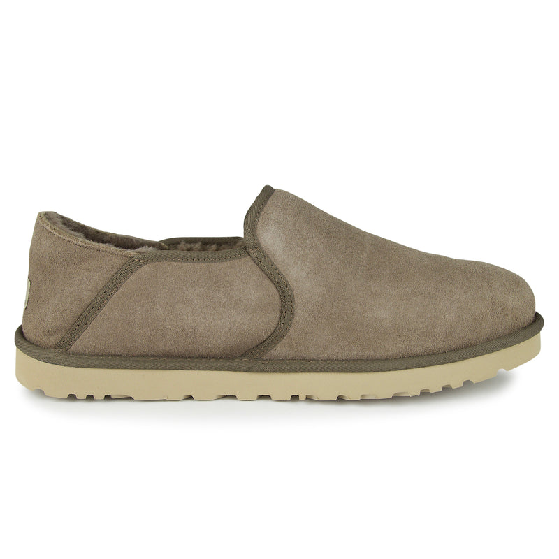 Kenton UGG slipper with collapsible heel, suede upper, and plush wool lining for warmth and comfort. Ideal for indoor or outdoor use.